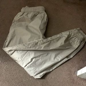 beige swoosh pants